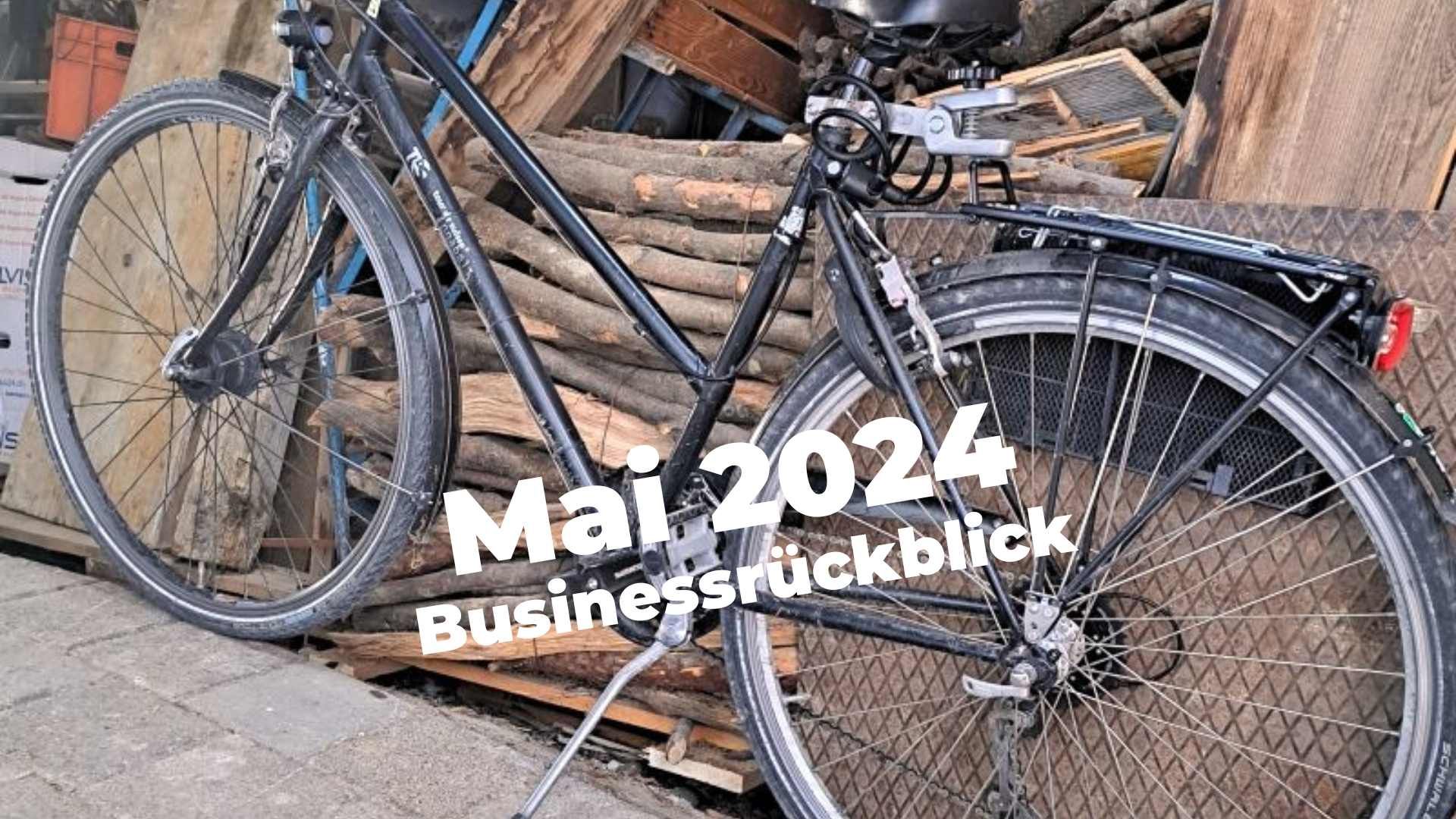 Businessrückblick Mai 2024: Mein Velo vor der Holzbeige